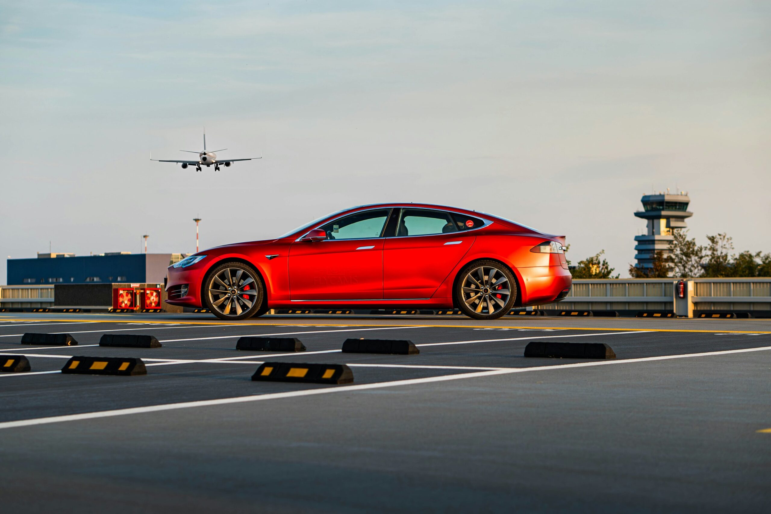 a red car standing on a airport background