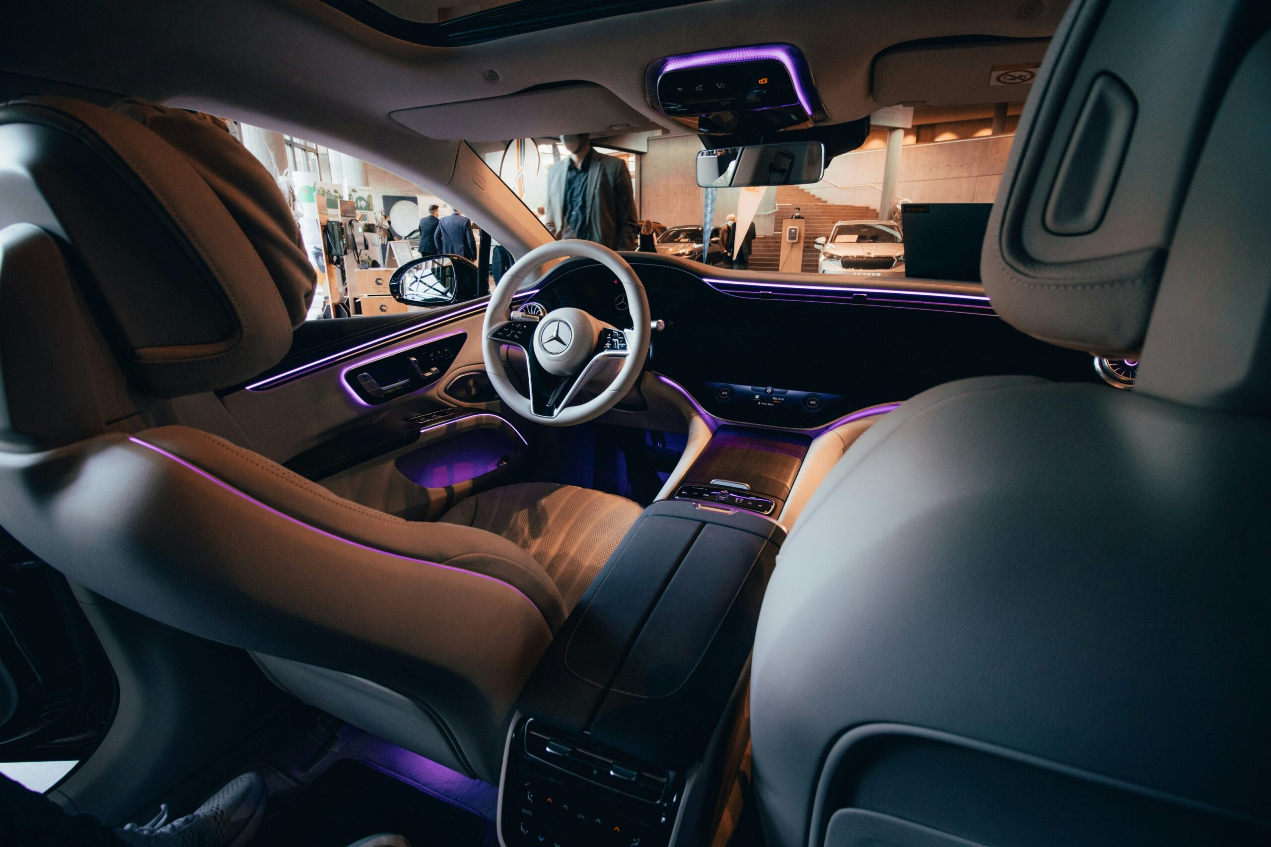 an white interior with purple leds of a car